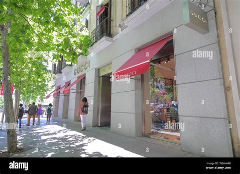 People visit Gucci store Serrano shopping street in Madrid Spain